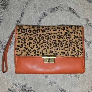 Gently used Fossil leather orange clutch